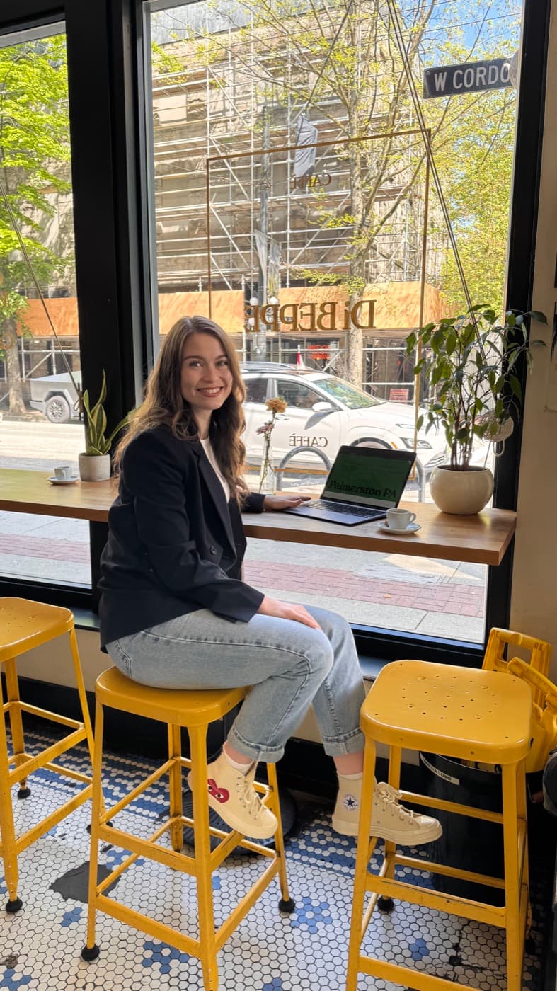 Olivia, Palmerston's founder, working from a cafe window seat in Gastown, Vancouver